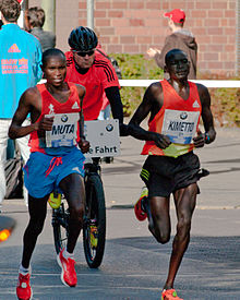 220px-Berlin_marathon_2012_buelowstrasse_between_kilometers_36_and_37_30.09.2012_10-51-10